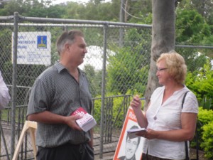 Photo of "Phil" handing out the bogus how-to-votes while talking to a News Limited journalist